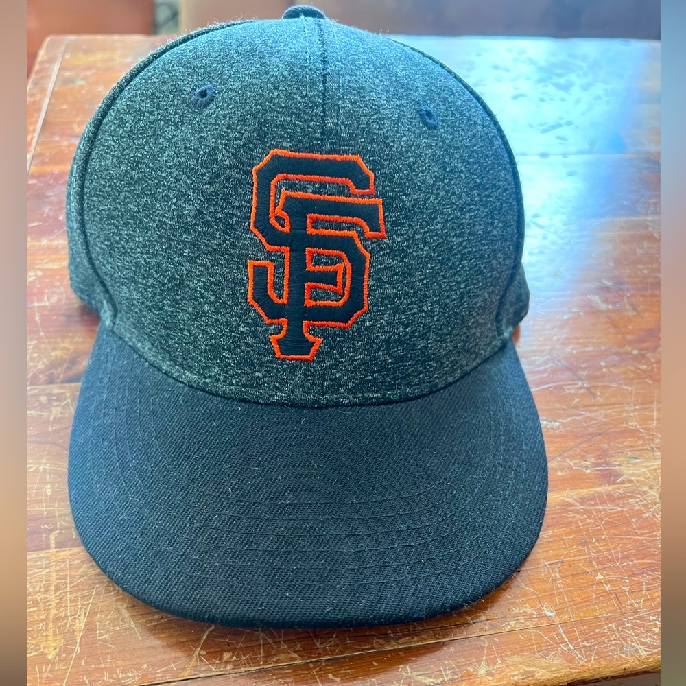 SF Giants baseball hat.